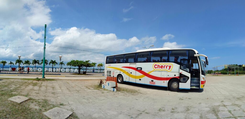 A Cherry Bus coach parked on the seafront at Puerto Princesa.