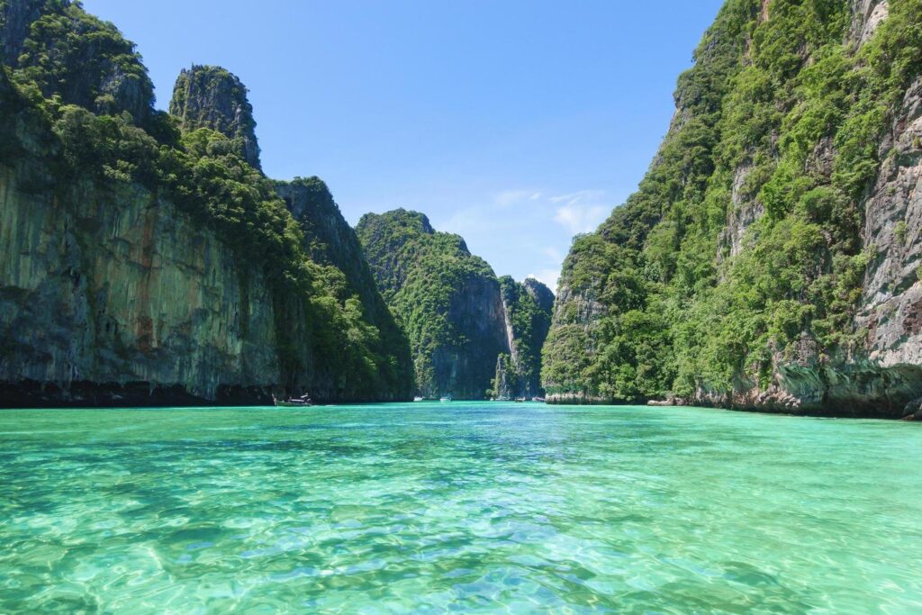 A turquoise lagoon enclosed by steep limestone cliffs in El Nido, Palawan.